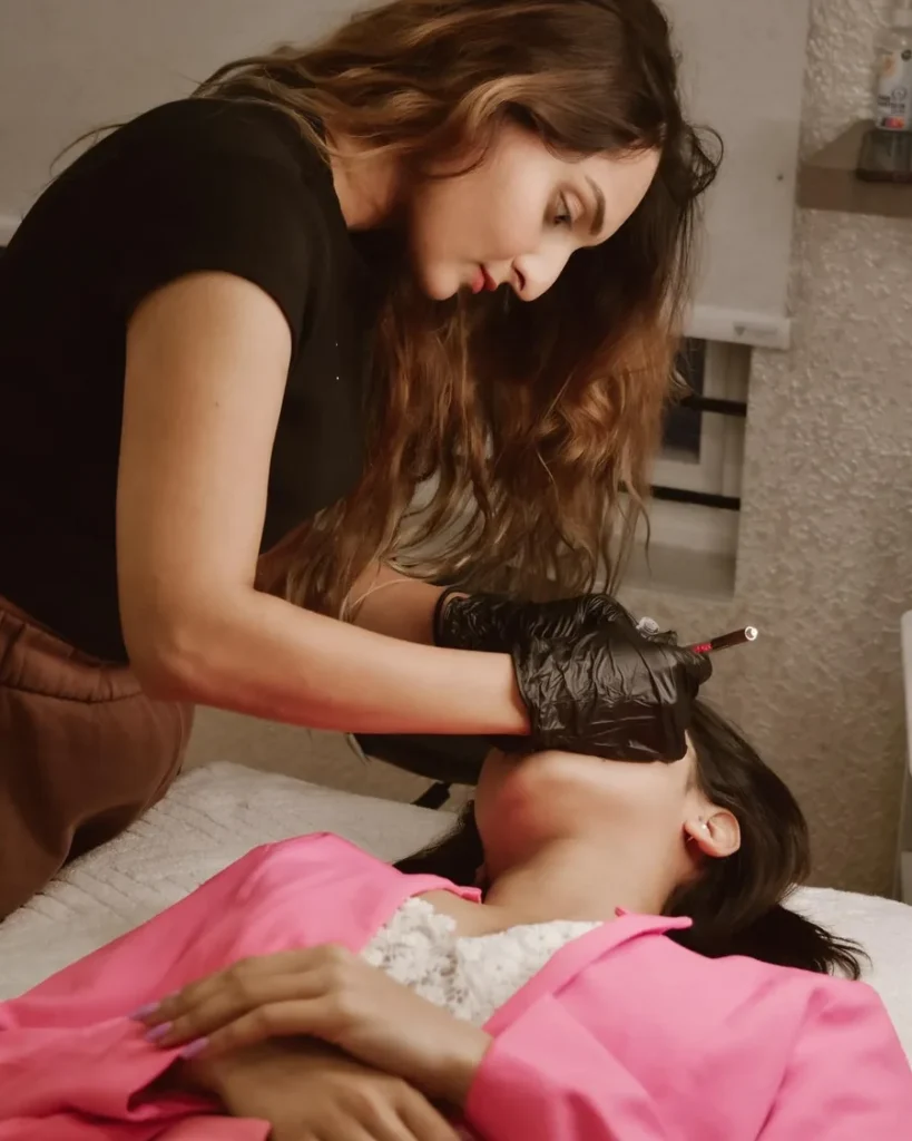 Anjali Sanghvi working on a client
