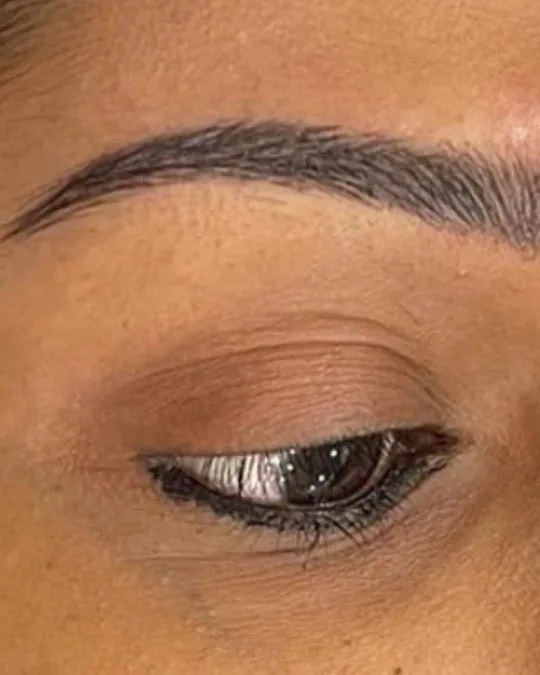 Eyeliner tattoo along the lash line